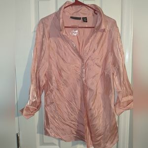 Shiny peach colored button-up blouse